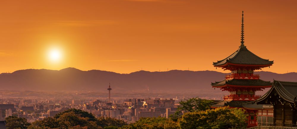 Kiyomizudera shrine in the foreground, Kyoto cityscape at dusk