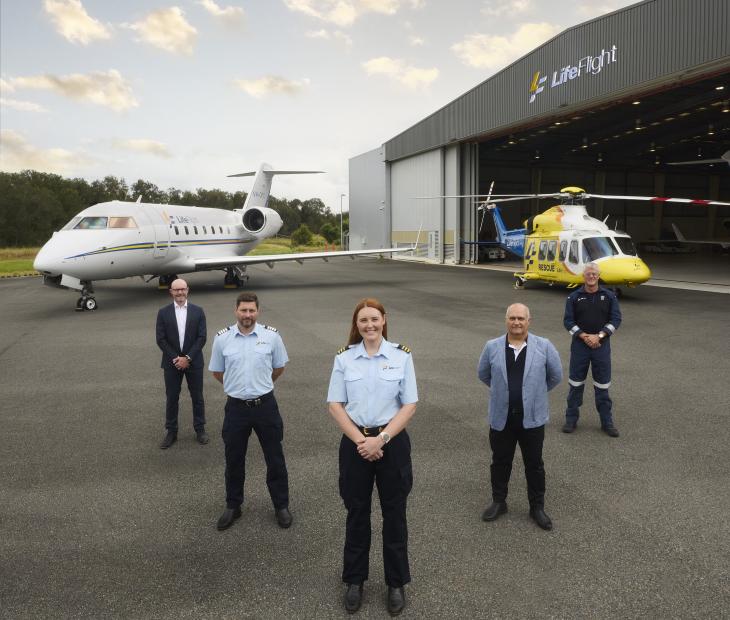 LifeFlight crew standing in front of aircrafts LifeFlight crew standing in front of aircrafts